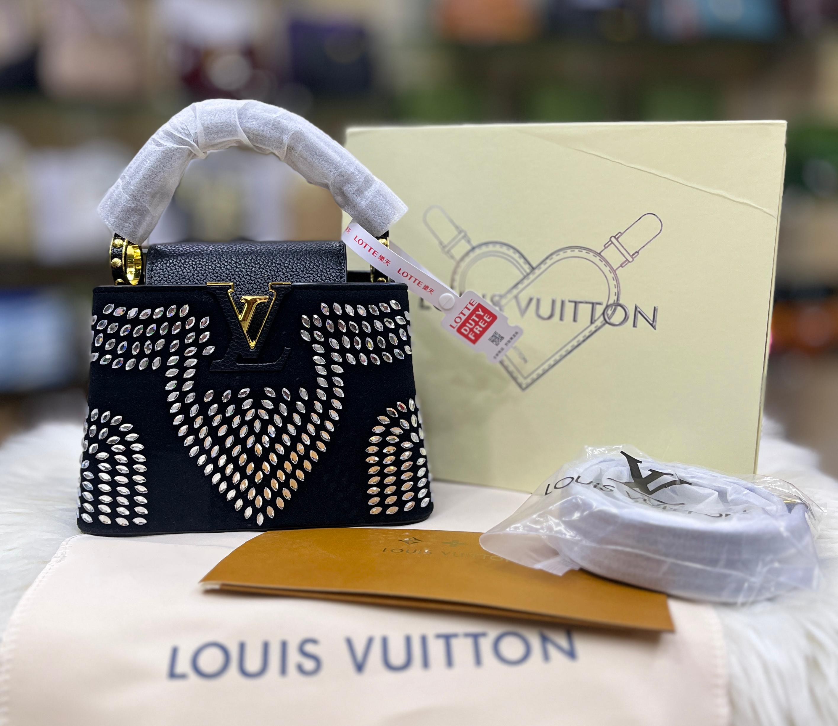 Louis Vuitton* Capucines Mini handbag