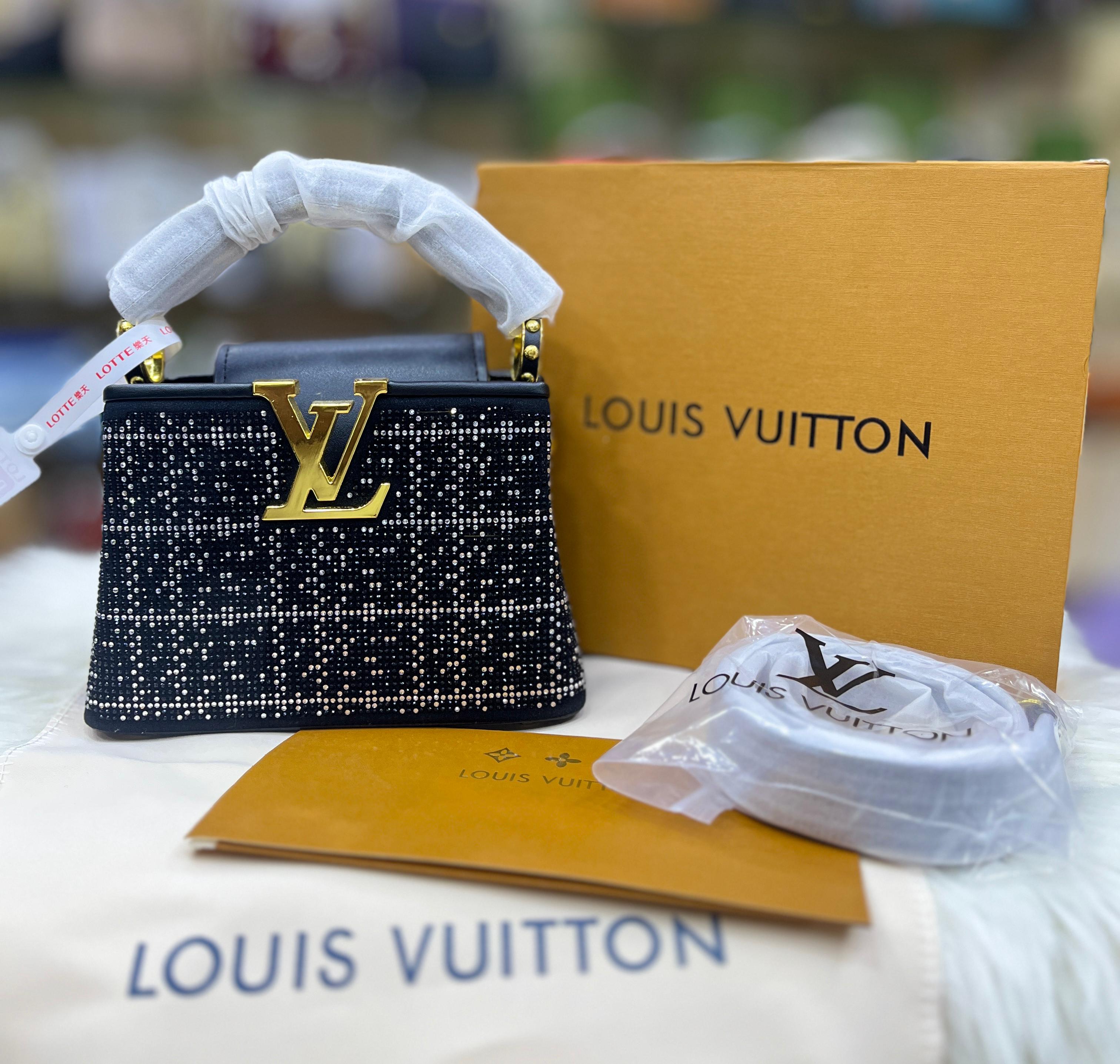 Louis Vuitton* Capucines Mini handbag