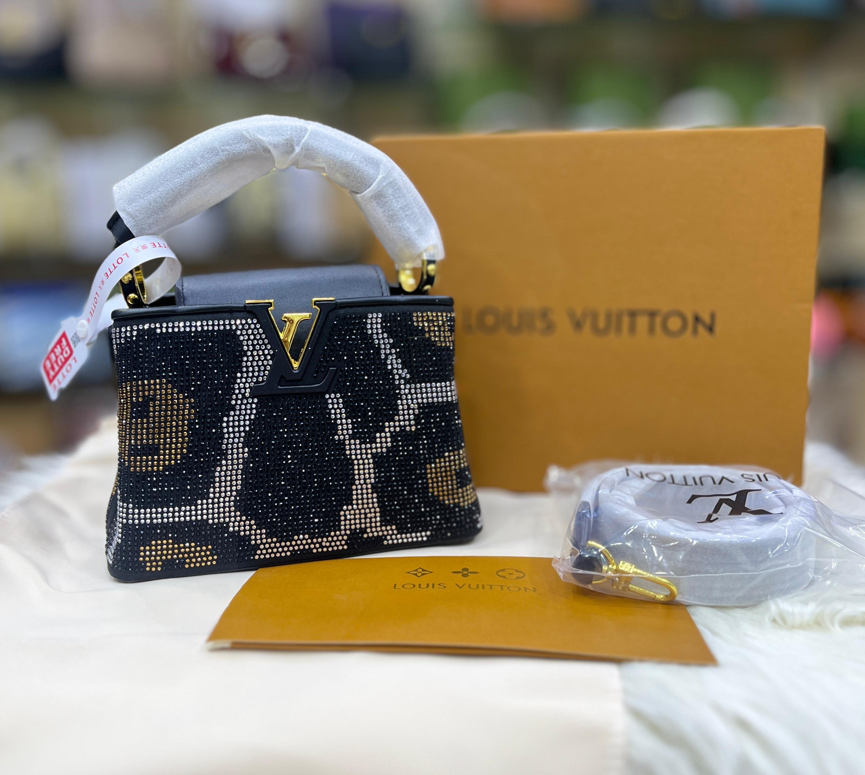 Louis Vuitton* Capucines Mini handbag